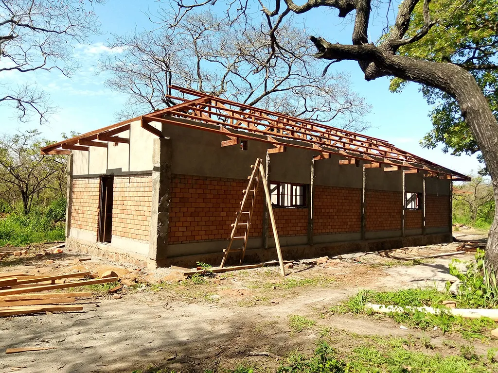 Roof framing on a dormitory at Camp Dungu