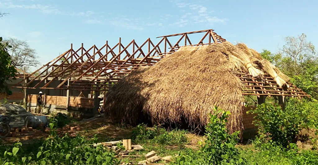 Thatching the roof of the restaurant and education area at Camp Dungu